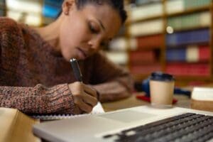 young woman writing